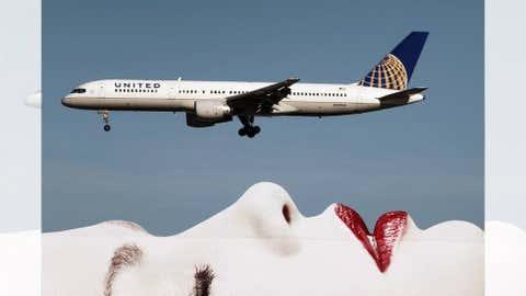 A United Airlines 757 passes a billboard on approach to Los Angeles International Airport (LAX) on January 17, 2013 in Los Angeles, California. (David McNew/Getty Images)