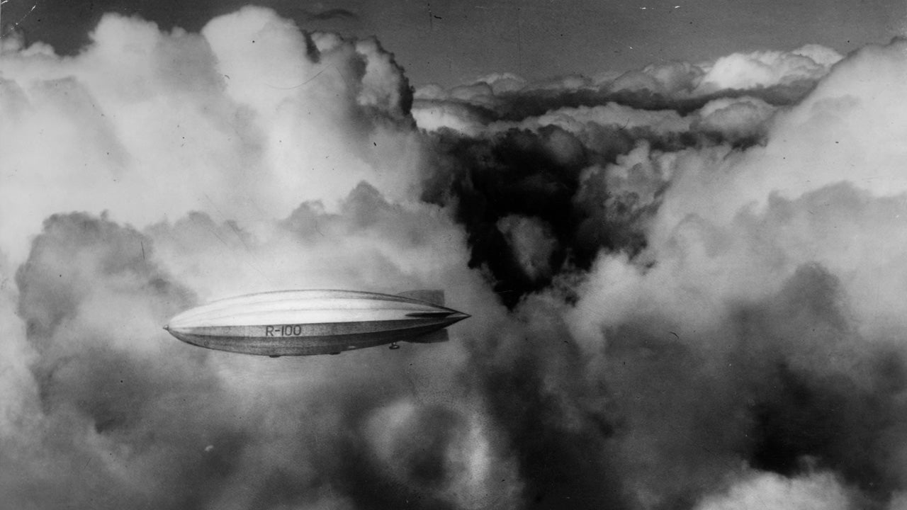 The British airship R-100, described as 'small hotel,' flies through a thick layer of cloud in 1929. The airship was designed to hold 100 passengers and was made up of three decks, with 14 two-berth and 18 four-berth cabins. She was scrapped after the crash of her sistership, the R-101, in 1930.  (Photo by General Photographic Agency/Getty Images)