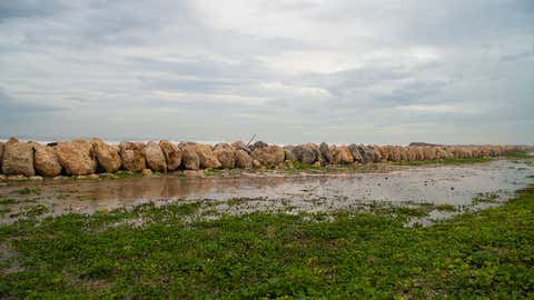 Rough waves overflow the banks of Palisaders Stripe, Kingston, Jamaica. (Ramesh Newell / weather.com)