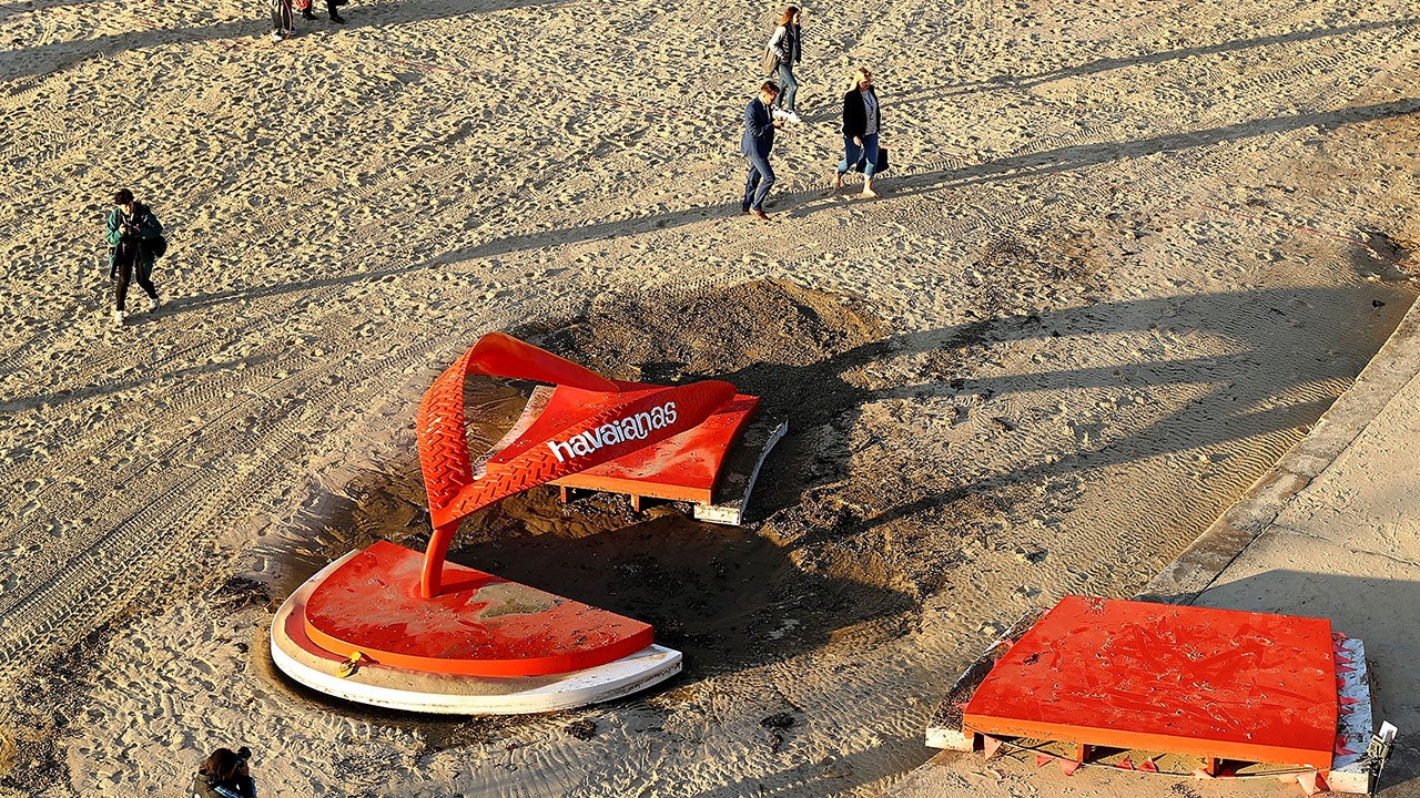 Thong vs. Sandfly by artist Jane Gillings is seen after it was damaged by a king tide at Sculpture By The Sea at Tamarama Beach on October 25, 2016 in Sydney, Australia. (Ryan Pierse/Getty Images)