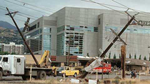 Windows in the Delta Center are shattered and the roof destroyed after a tornado swept through downtown Salt Lake City 11 August 1999. (Photo credit: GEORGE FREY/AFP/Getty Images)