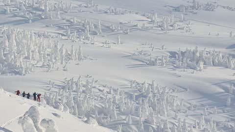 Hikers making their way through heavy snow in a 5000ft high mountain range in below-freezing temperatures, in the Hakkoda Mountains, near Aomori, Japan. (Sho Shibata / Solent News and Photo Agency)