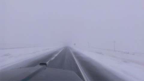 The western Nebraska town of Arthur saw two feet of snow on March 27, 1939. Image: Driving on I-80 westbound in western Nebraska in a snowstorm. From iWitness Weather contributor singledaddyw4kids.