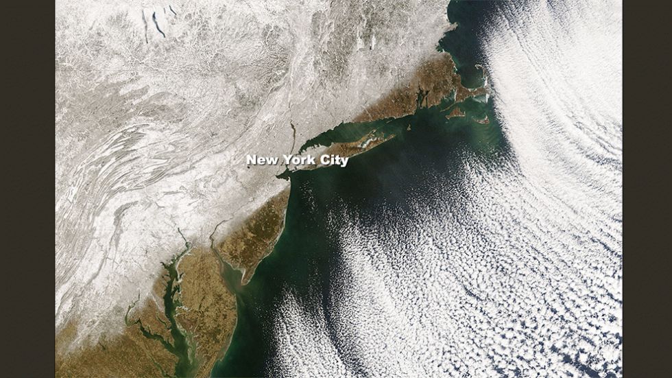 This image clearly shows the dividing line between fresh snow cover and bare ground right along the I-95 corridor in the Northeast.
