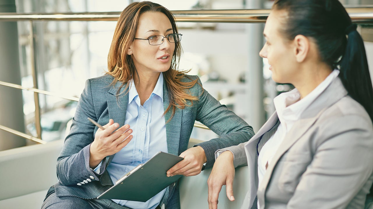 Hr manager asking questions to female candidate