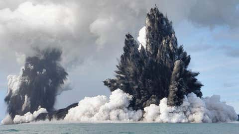 An undersea volcano is seen erupting off the coast of Tonga, sending plumes of steam, ash and smoke hundreds of feet into the air on March 18, 2009. (Dana Stephenson/Getty Images)