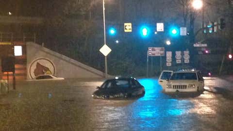 Several vehicles were submerged at the University of Louisville campus at Eastern and Third Streets. (Tim Elliot/WLKY)