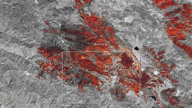 False-color shortwave infrared satellite image showing the Valley Fire burn scar near Middletown, California on September 20, 2015. Burned areas appear orange or dark red. (NASA Earth Observatory)