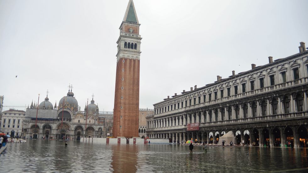 St Mark's square is flooded during a 'acqua alta' on October 27, 2012 in Venice. The 'acqua alta', a convergence of high tides and a strong sirocco, reached 127 centimeters in the morning. (Photo credit:  ANDREA PATTARO/AFP/Getty Images)