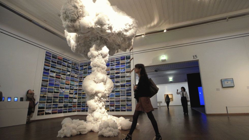 A woman walks next to an artwork by artist Dietrich Wegner, titled &lsquo;Playhouse&rsquo; and dated 2008-2012, as part of the &lsquo;Clouds&rsquo; (Wolken) exhibition at the Leopold Museum in Vienna, Austria. The exhibition will run through July 1, 2013.  (Photo: Alexander Klein/AFP/Getty Images)