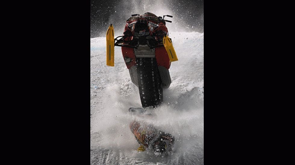 Caleb Moore crashes during the snowmoblie freestyle finals Thursday, Jan. 24, 2013, during the first day of the X Games Aspen 2013. (AP Photo/The Gazette, Christian Murdock)