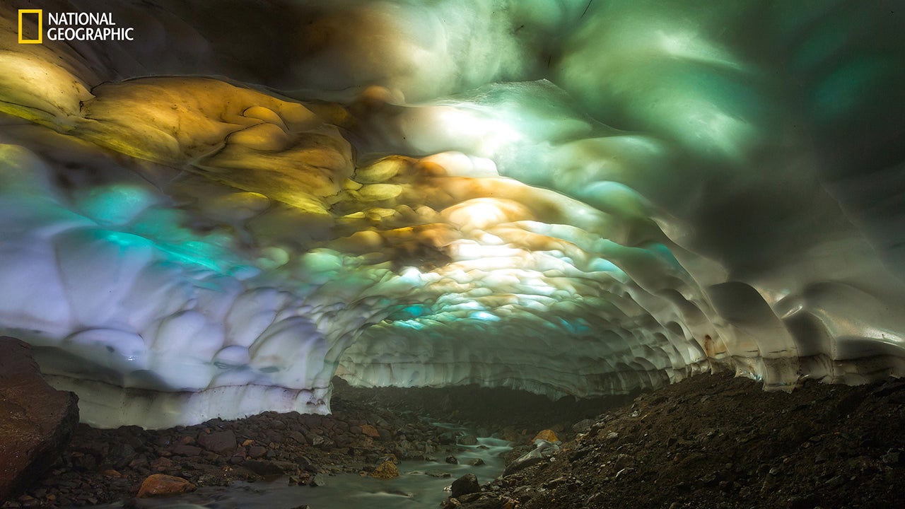 "Snow cave on the slopes of the volcano Mutnovsky. Due to of global warming, glaciers have begun to decline. As a result, the ceiling of the cave became thin and the sunlight creates a wonderful picture of the different colors." (Photo and Caption by Denis Budkov/2016 National Geographic Nature Photographer of the Year)