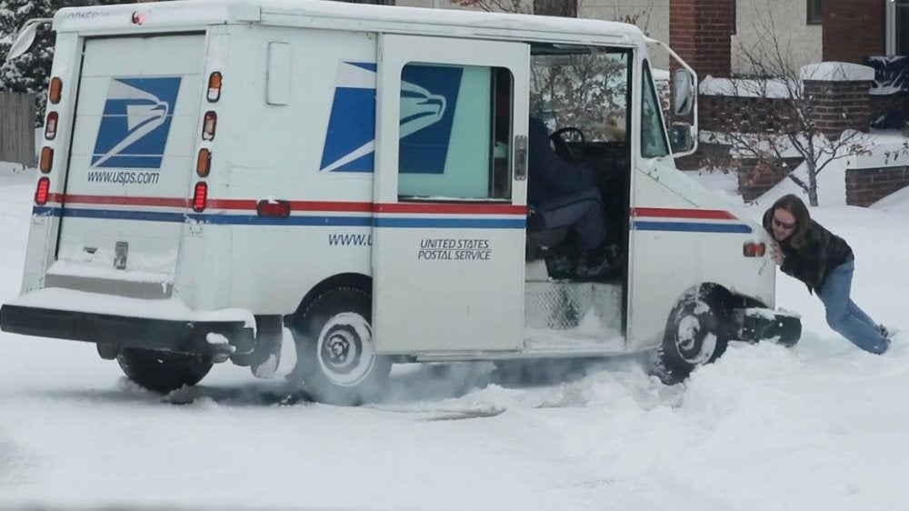 Mail Truck Stuck Spinning in Snow
