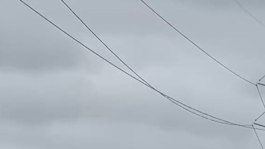 Ice-Encrusted Power Lines 'Gallop' in the Wind