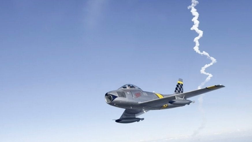 Vintage Fighter Jet Soars as Rocket Launches