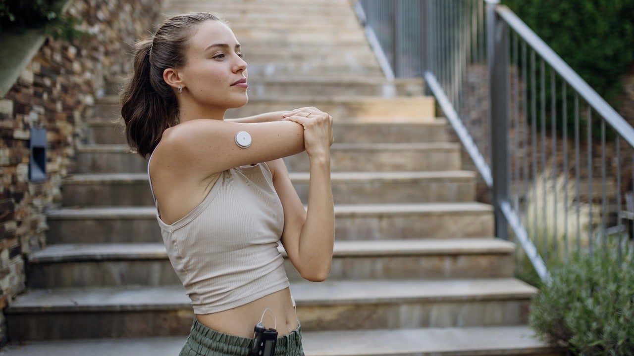 Woman with blood sugar monitor