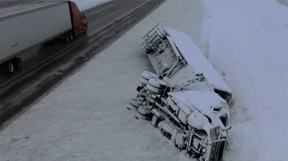 Eerie Scene Of Semi Flipped Along Snowy Highway