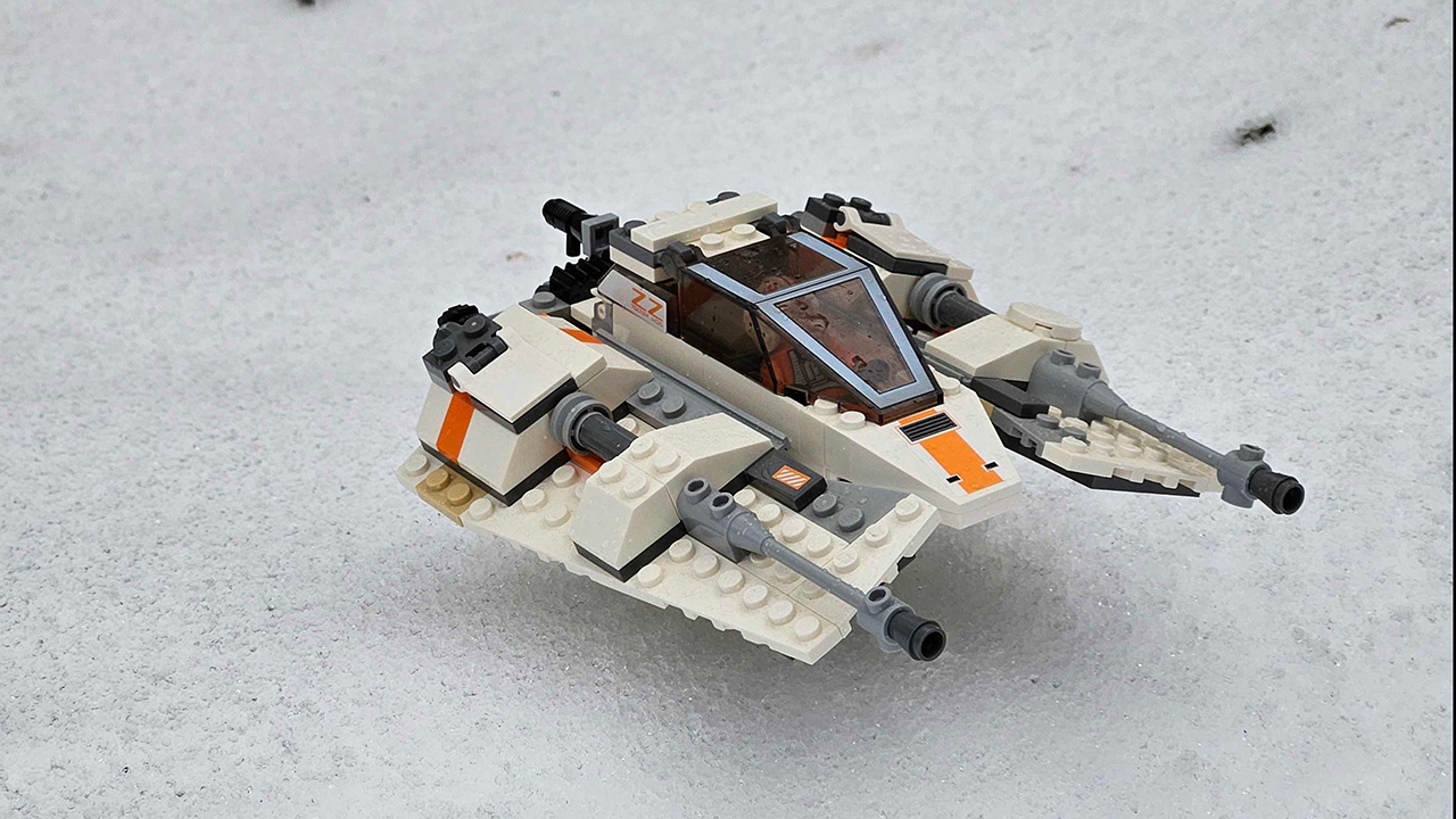 A Star Wars-themed LEGO creation is photographed in the snow.
