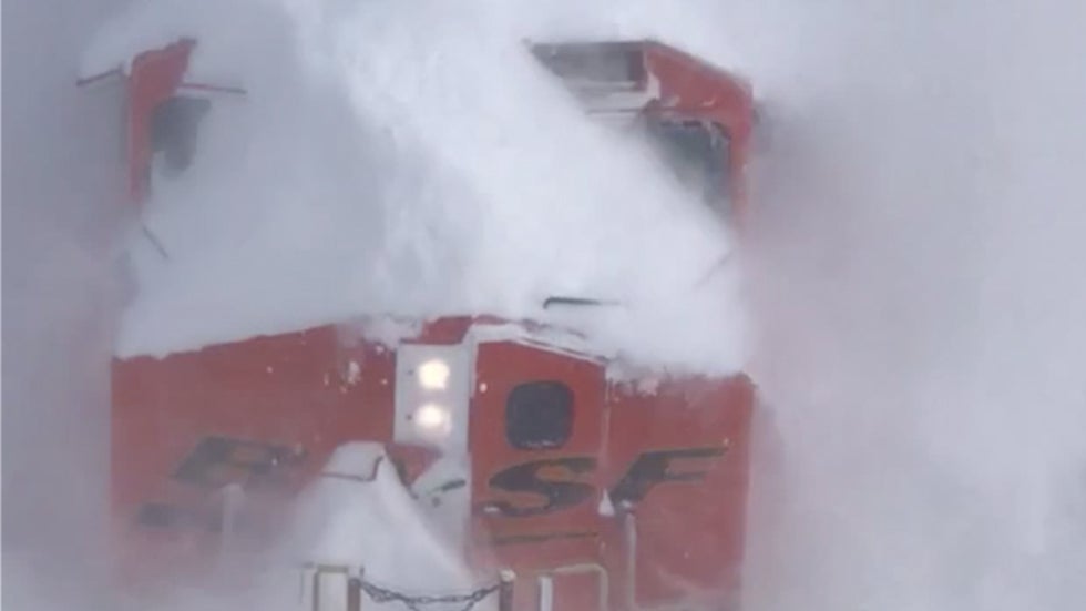 Snow No Match for Train Carving Through Countryside