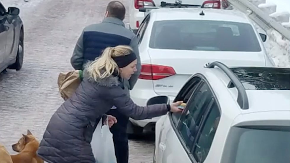 Snowbound Motorists' Spirits Lifted by Mystery Couple Videos from The