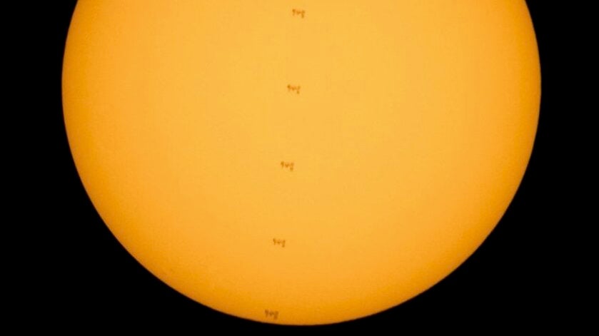 Astronauts Captured Traversing the Sun on the International Space Station