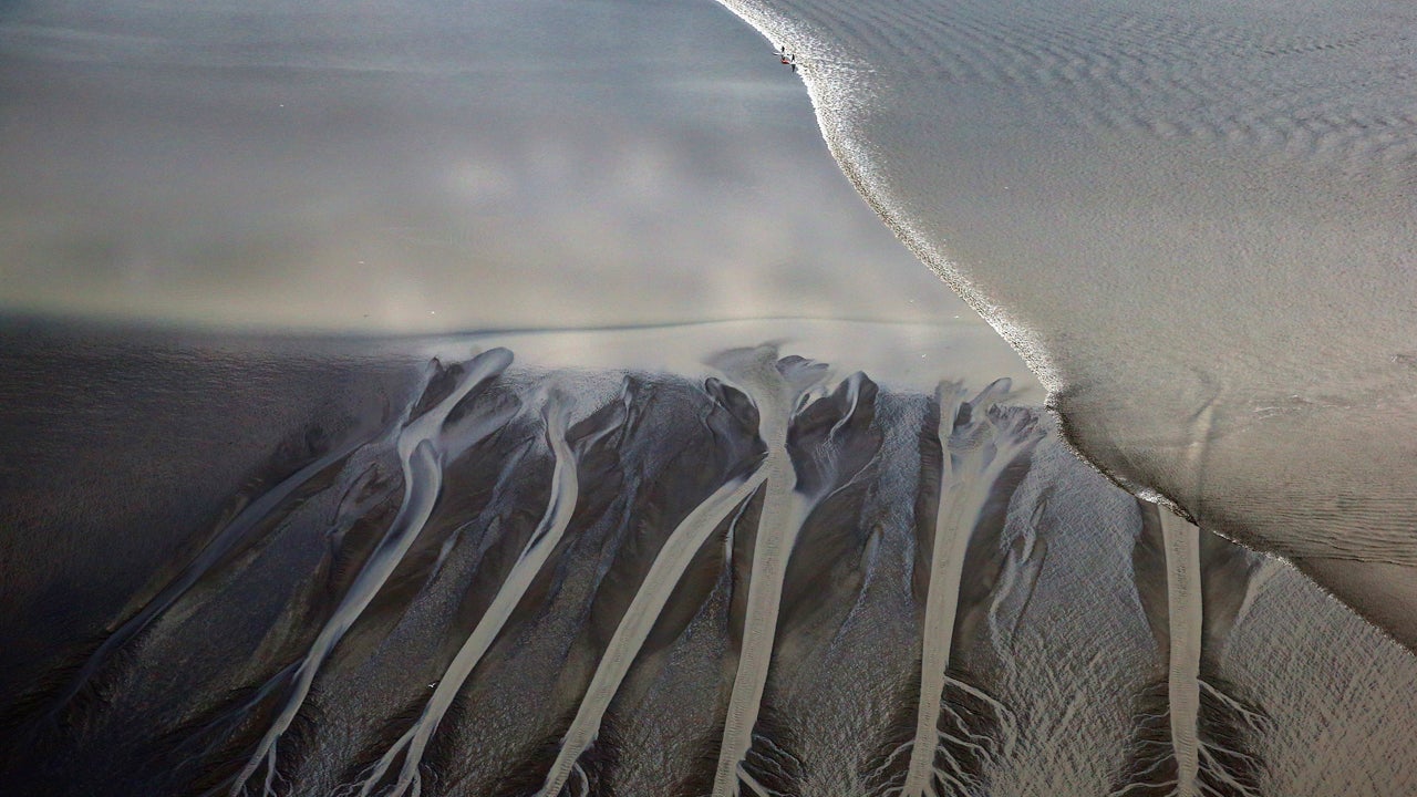 Surfers Ride Alaska's Bore Tide (PHOTOS)
