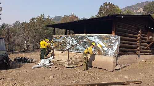 Historical Cabin Covered in Tinfoil For Protection From Wildfires