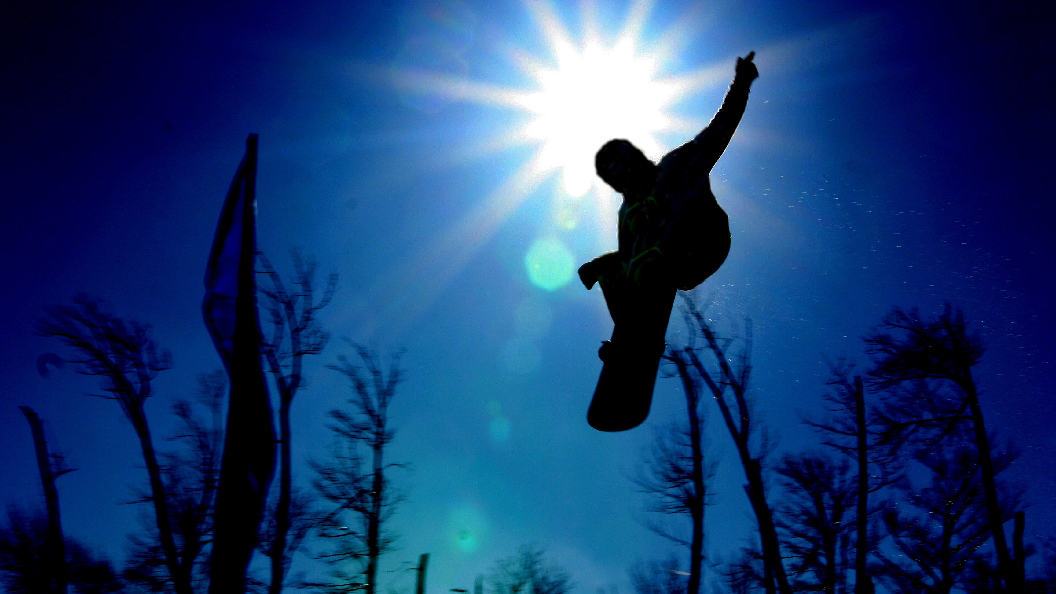 15 Photos of Snowboarders Defying Gravity