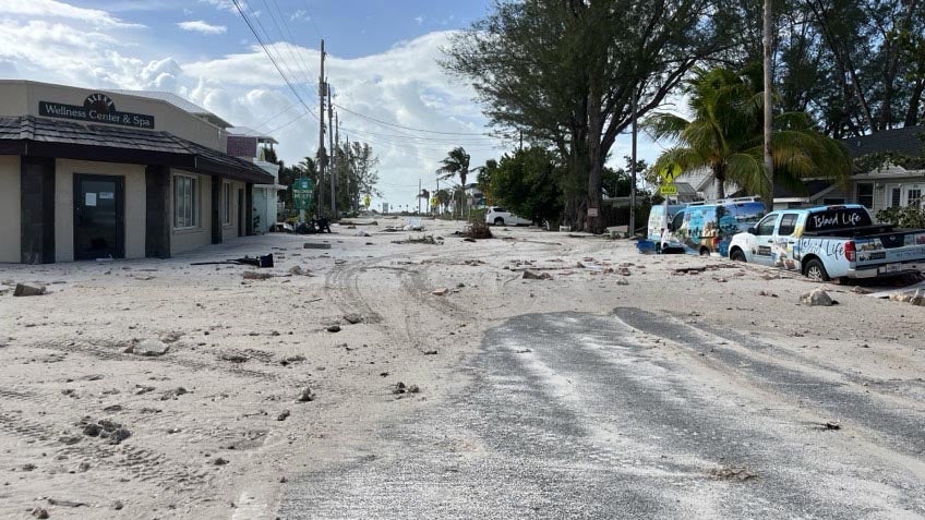 Sand covers a street.