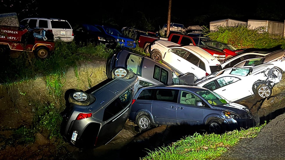 Cars are stacked on each other after flash flooding in Leburn, Kentucky, on Thursday, July 28, 2022. (Brandon Clement/LSM)