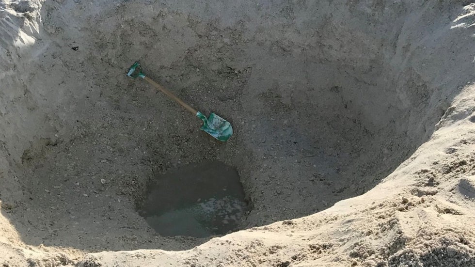 Danger Of Digging Holes In The Sand At The Beach