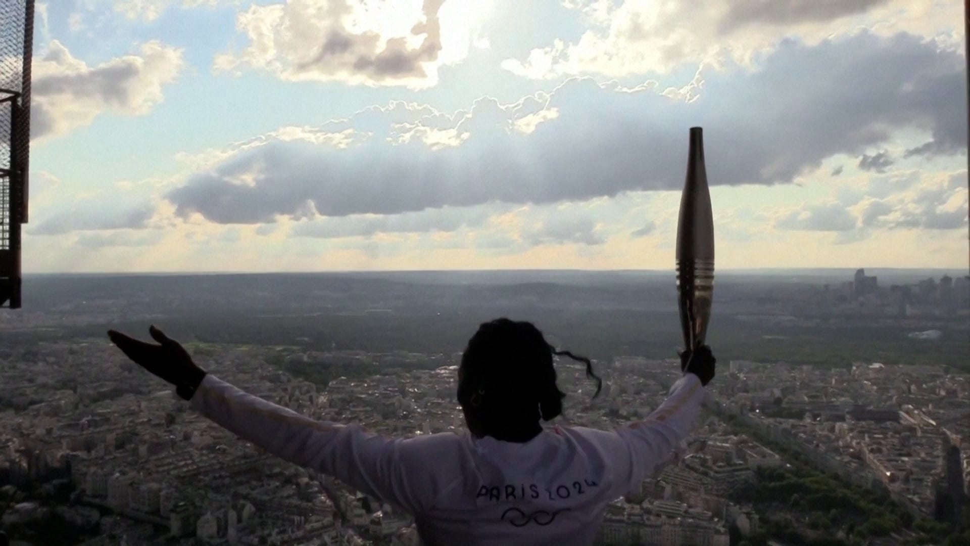 Olympic Torch Climbs The Eiffel Tower