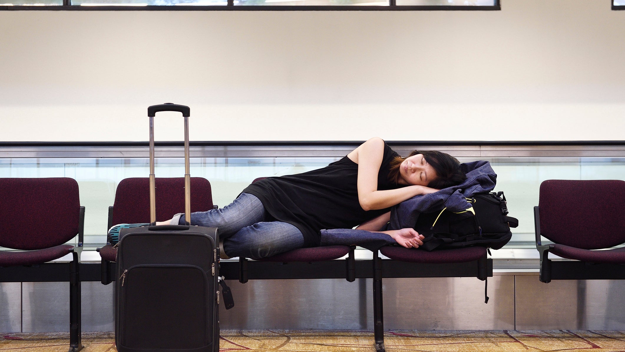 Stuck At The Airport? Here's How To Sleep Safely And Comfortably (Mostly)