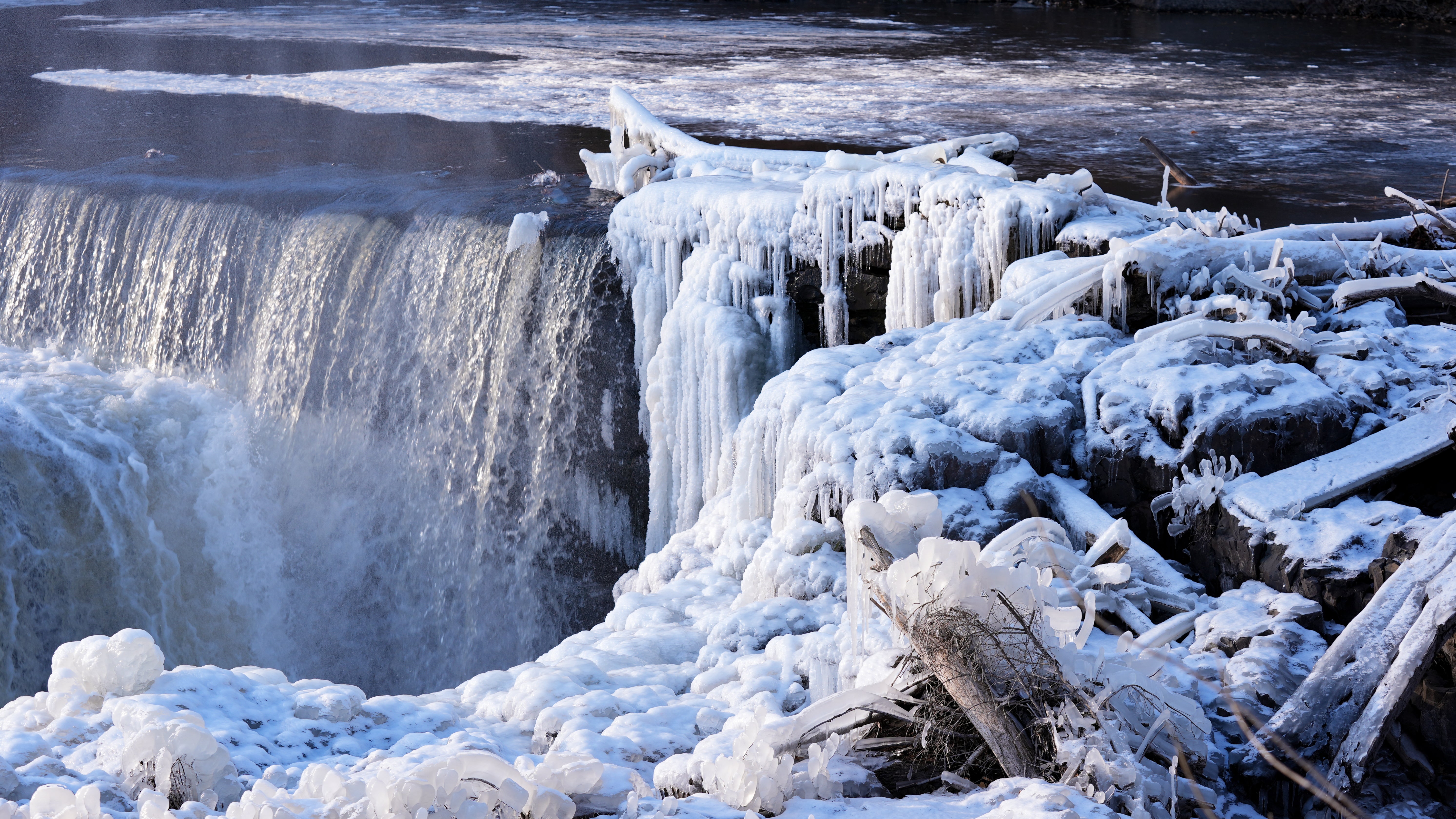 Ice hangs from the frozen Paterson Great Falls National Park in Paterson, New Jersey.