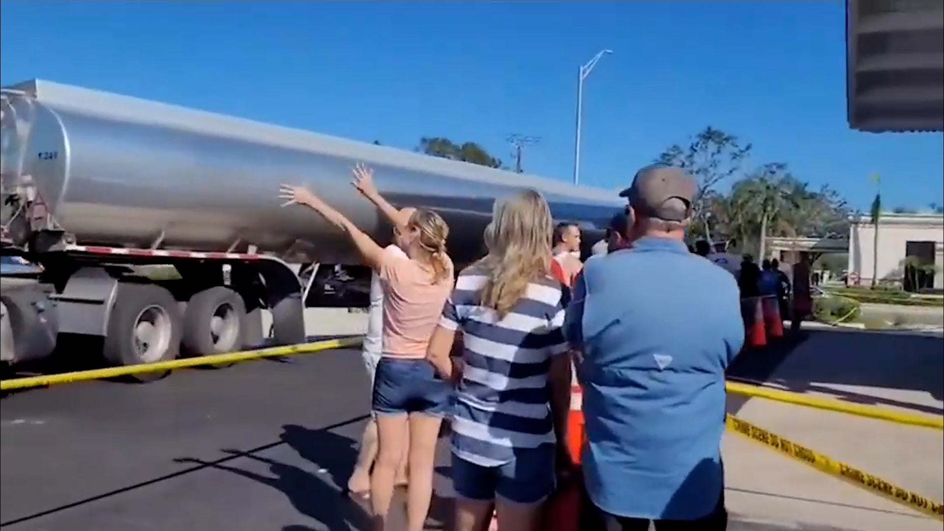 Florida Drivers Waiting In Long Lines Welcome Fuel Tankers