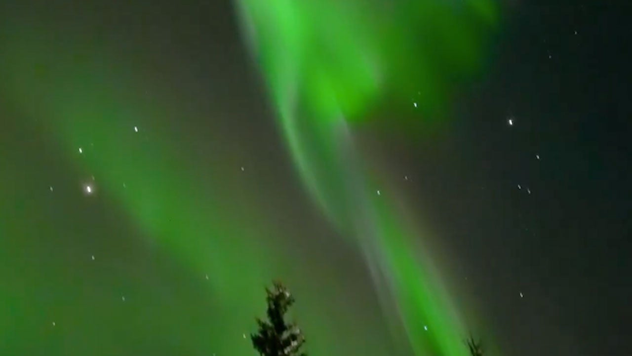 Man Walks Outside And Steps Into Stunning Aurora Scene Over Alaska