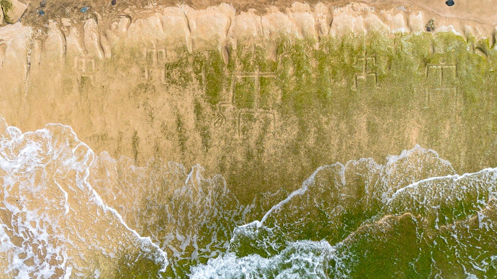 Changing Tides Reveal Ancient Hawaiian Petroglyphs | Weather.com