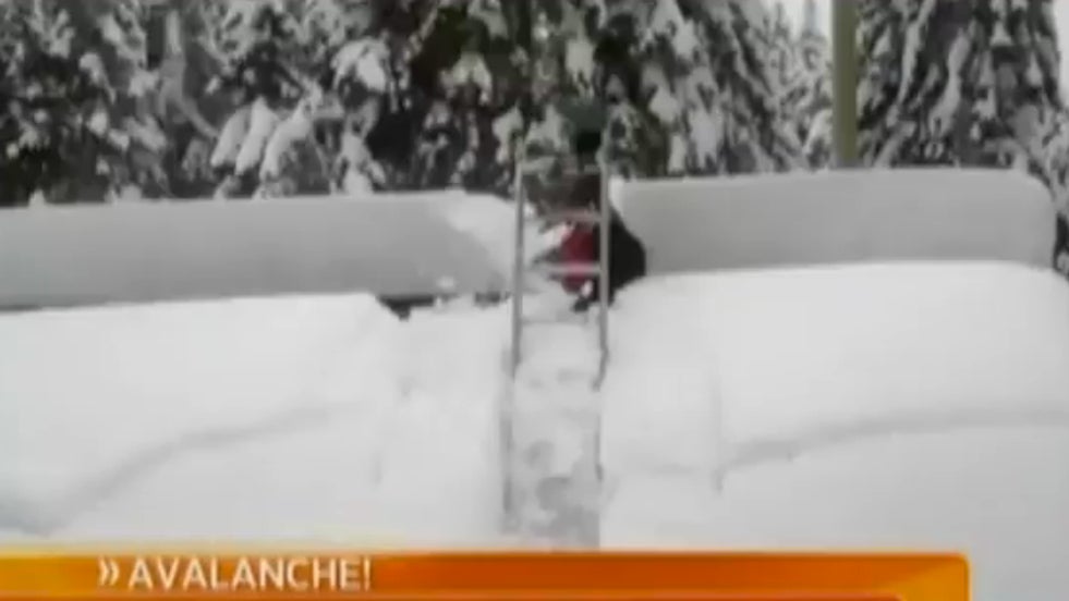 Snow Sweeps Guy off Roof (Video)