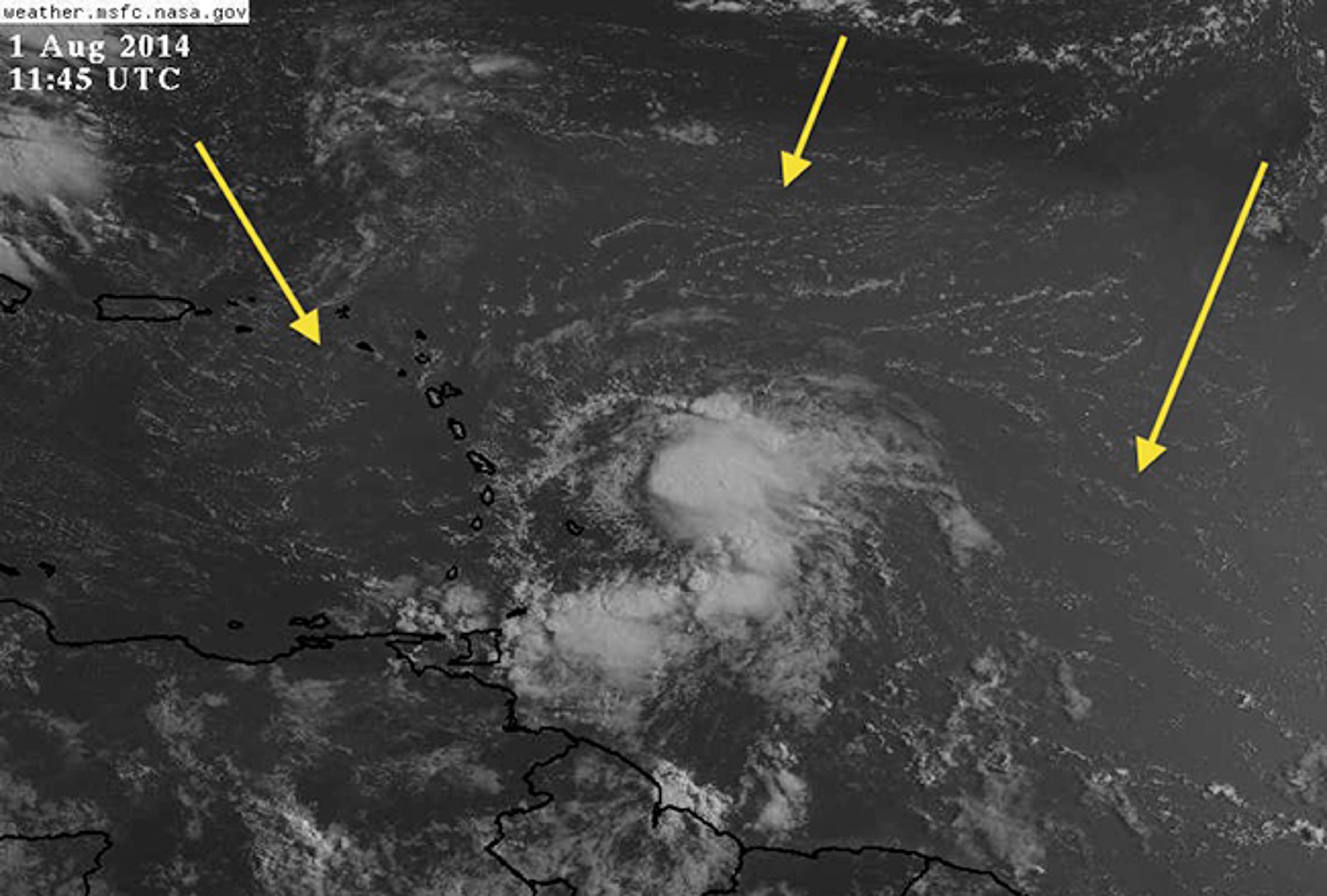 Visible satellite image of Tropical Storm Bertha on August 1, 2014, east of the Windward Islands. Yellow arrows and milky texture denote the dust embedded in the Saharan air layer surrounding the tropical storm at that time.