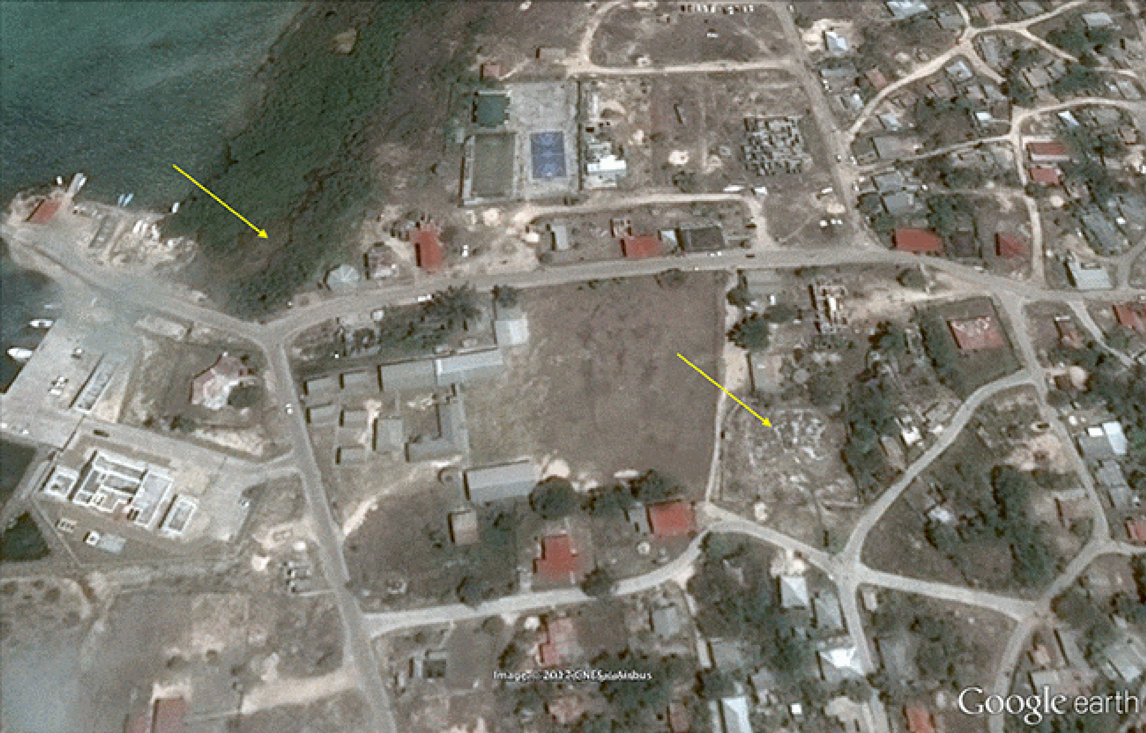 Before/after images of damage from Hurricane Irma in Codrington, Barbuda, in September 2017. Yellow arrows point to areas with standing water remaining after Irma. 