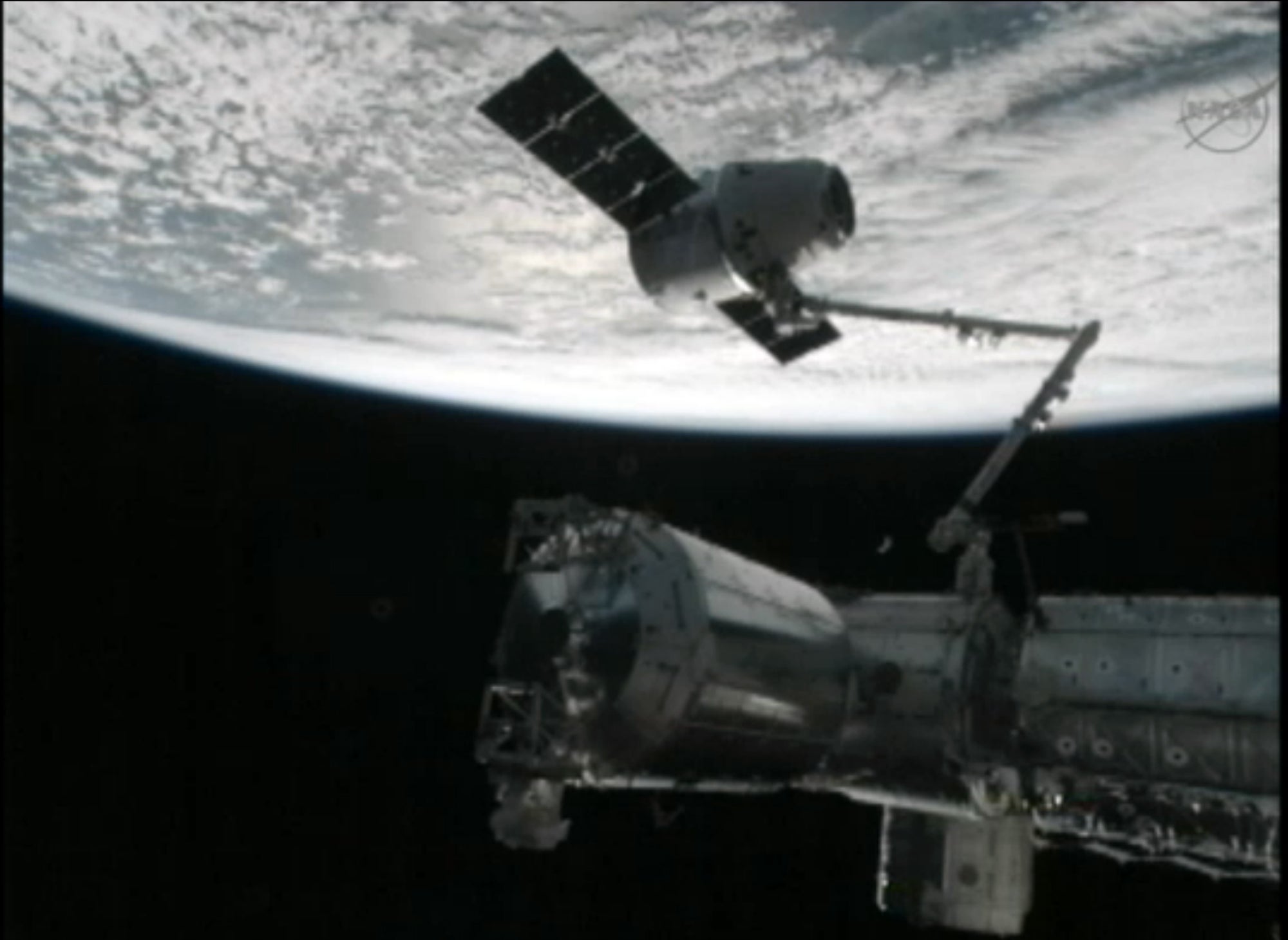 Spaceworks Capsule SpaceX Capsule Docks with Space Station | The Weather Channel