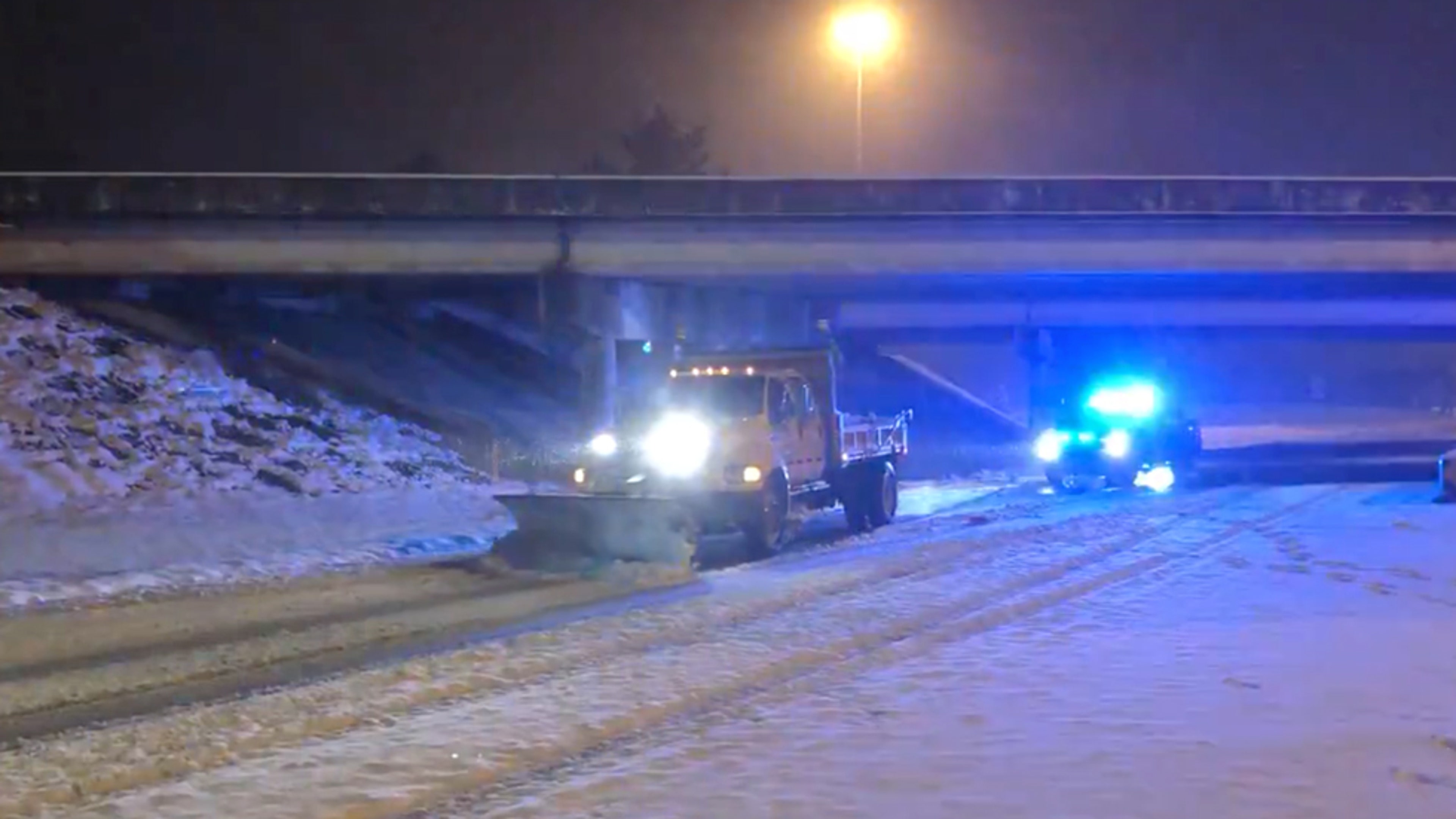 A plow clears snow on Interstate 10 in northwest Florida on Jan. 21, 2025.