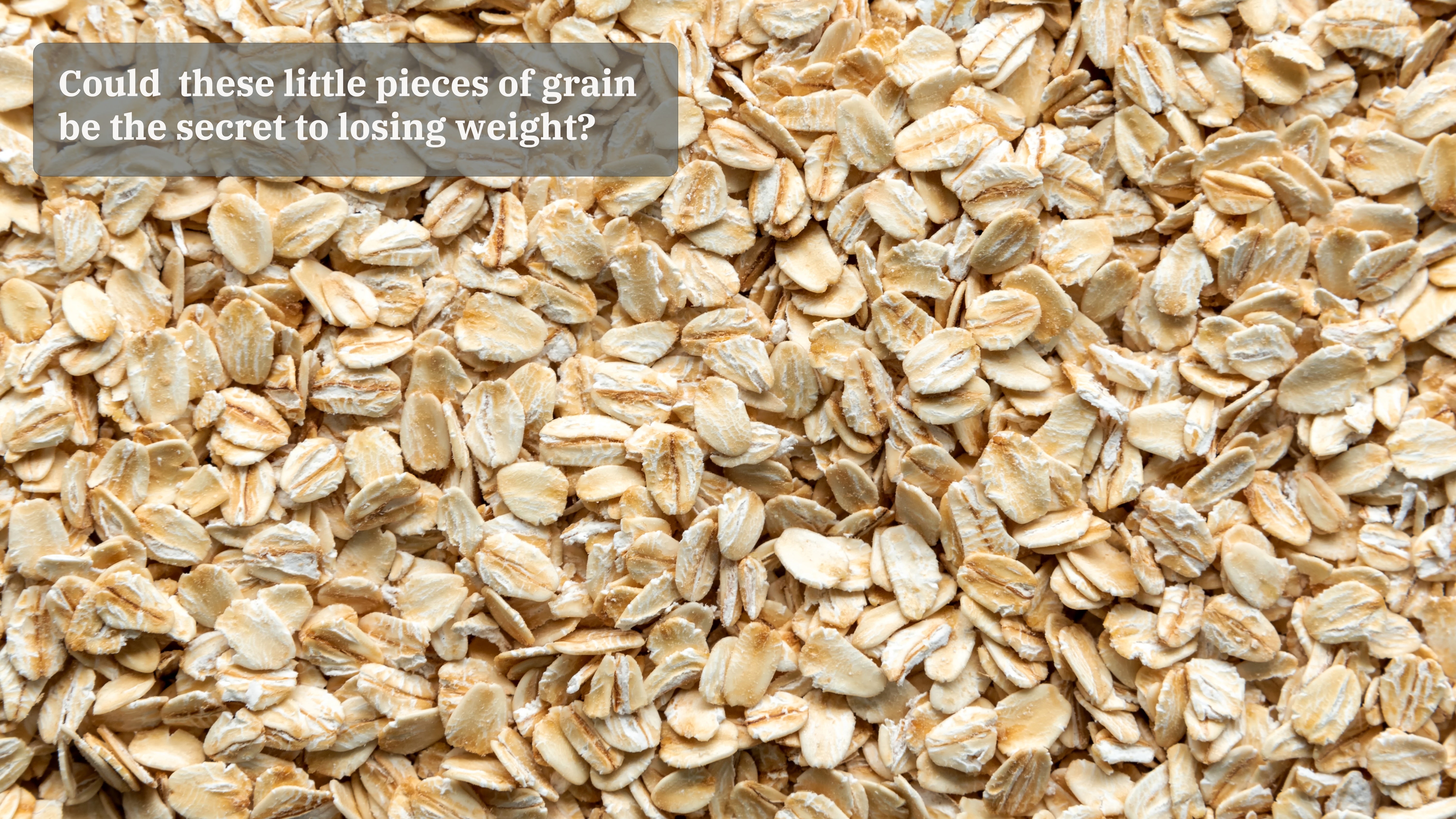 A close up of oat flakes are seen with an on-photo caption that reads: "Could these little pieces of grain be the secret to losing weight?"