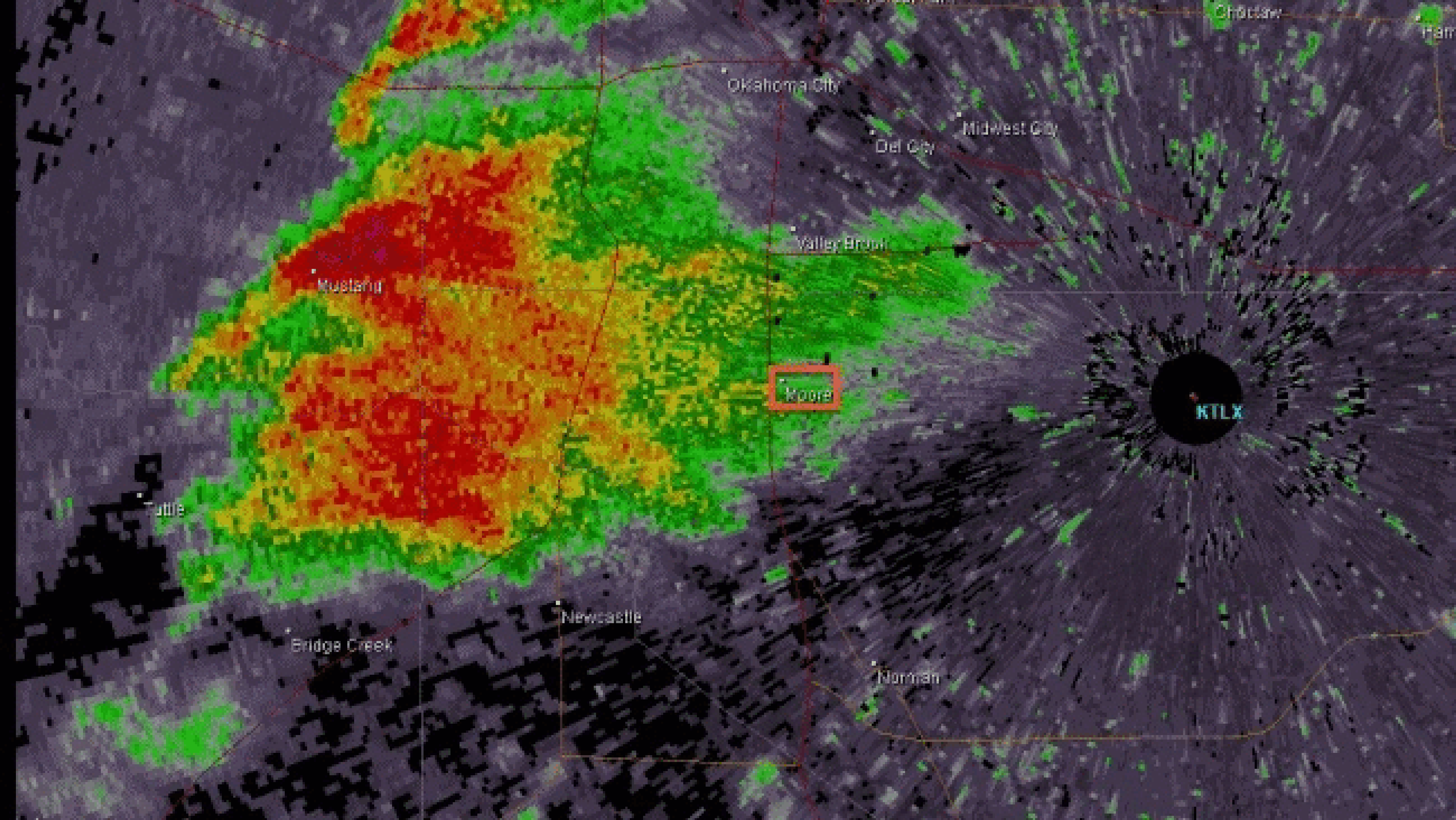 Radar loop of May 20, 2013 Moore, Okla. tornadic supercell from 3:25 p.m. to 4:34 p.m. CDT. The location of Moore, Okla. is denoted by red box near the center of the loop. The location of the tornado is denoted by the debris ball of higher reflectivity headed toward Moore. The yellow arrow denotes the decaying thundershowers tracking toward the Moore supercell. (Credit: National Weather Service - Norman, Okla.)