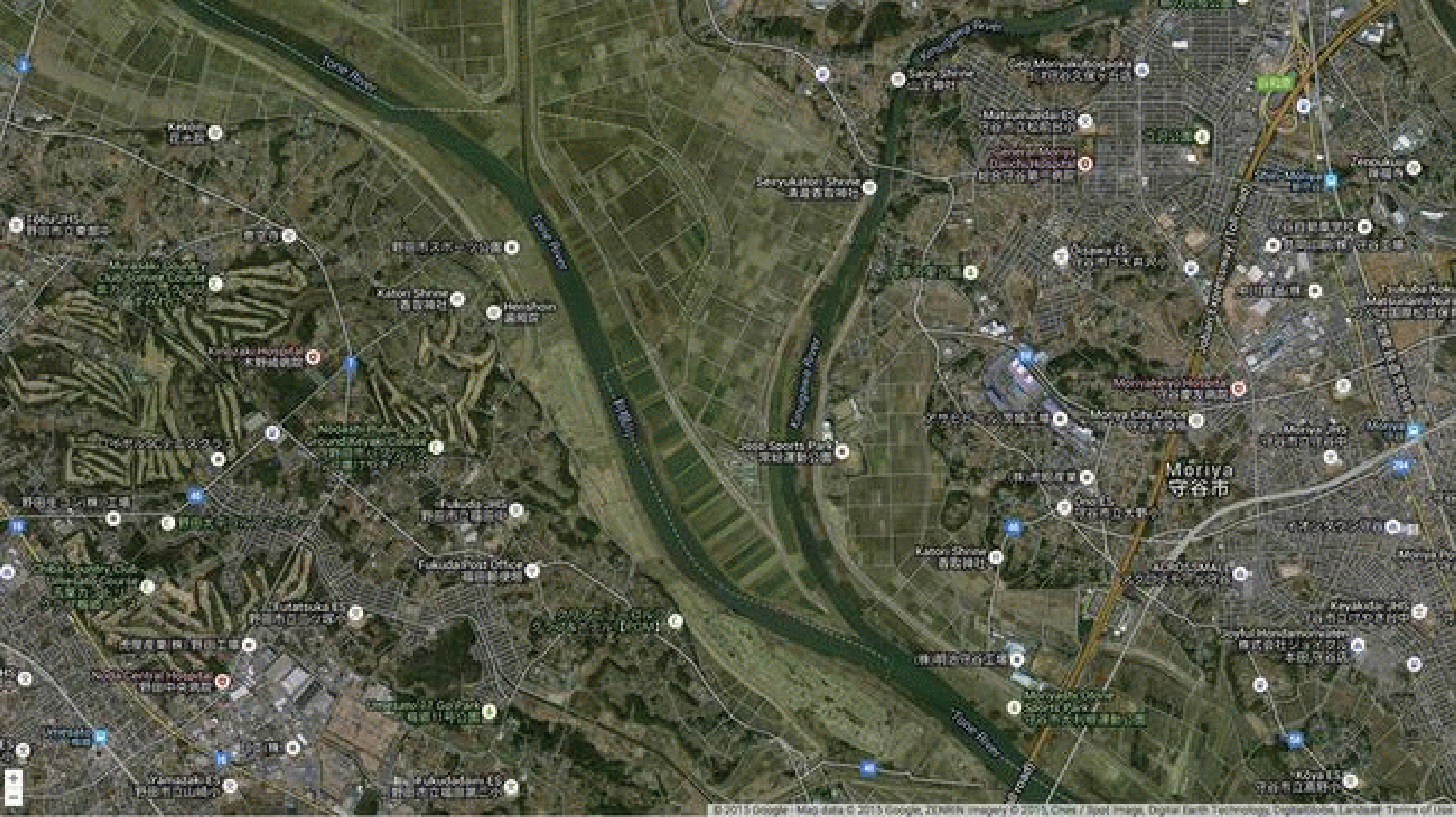The confluence of the swollen Tone River (upper left to lower right) and Kinugawa River (from top center) inundates a triangle-shaped floodplain southwest of Moriya, Japan on September 11, 2015.