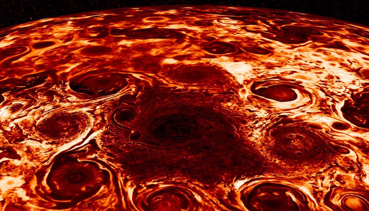 Jupiter's Otherworldly Weather Revealed: Massive Cyclones on Planet Pack Winds Exceeding Category 5 Hurricanes