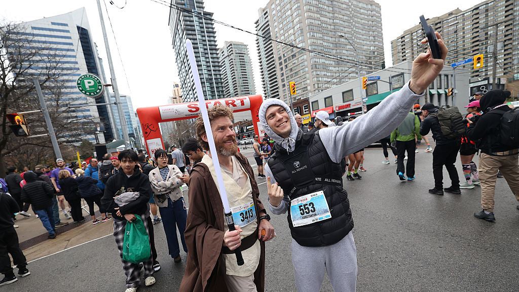 A man dressed as Obi-Wan.