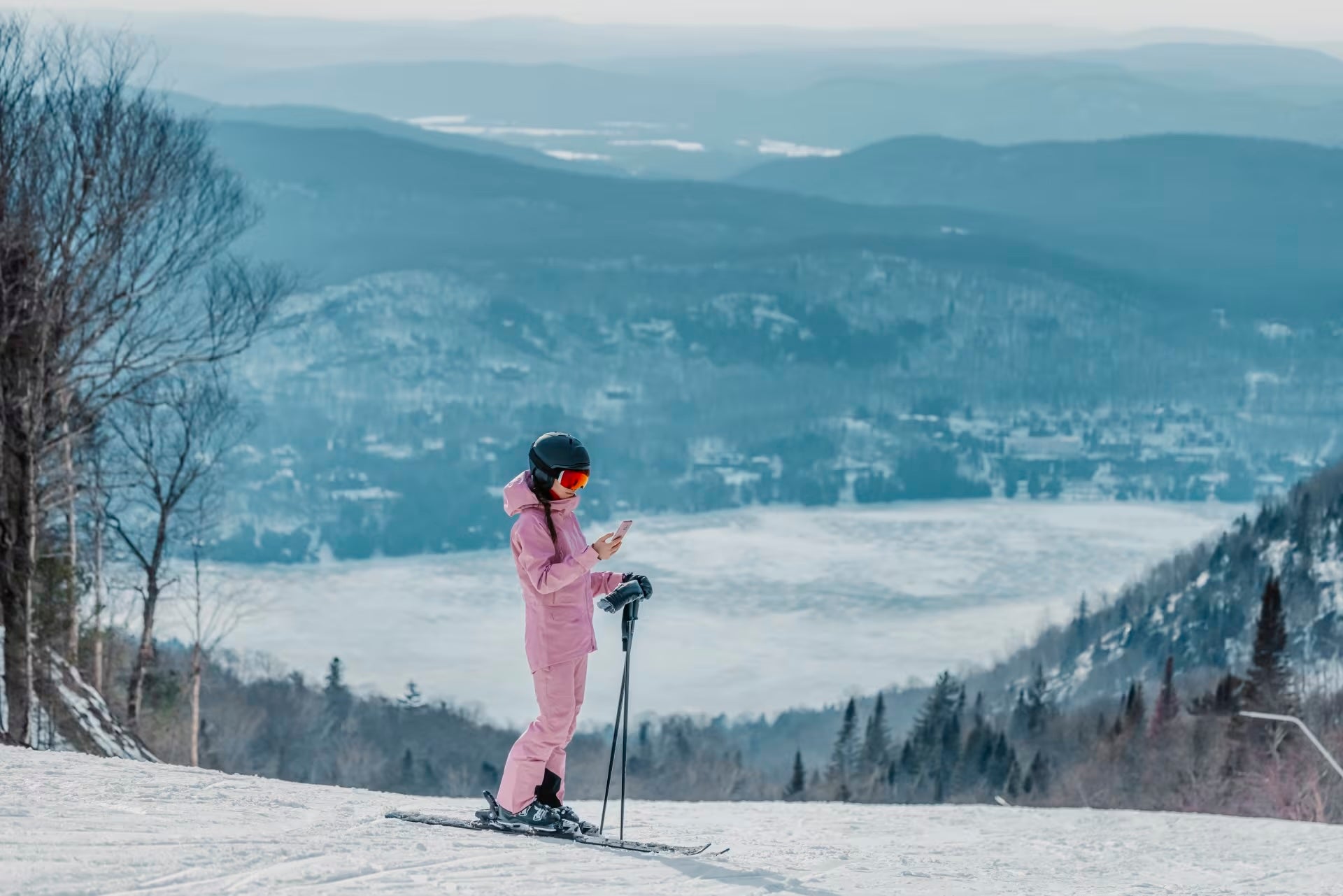 phone-on-ski-vacation-woman-skier-using-phone-app-on-ski-trail-slope-in-amazing-winter-nature-landscape-girl-looking-at-mobile-smartphone-wearing-awesome-ski-clothing-helmet-and-goggles-64712.jpeg