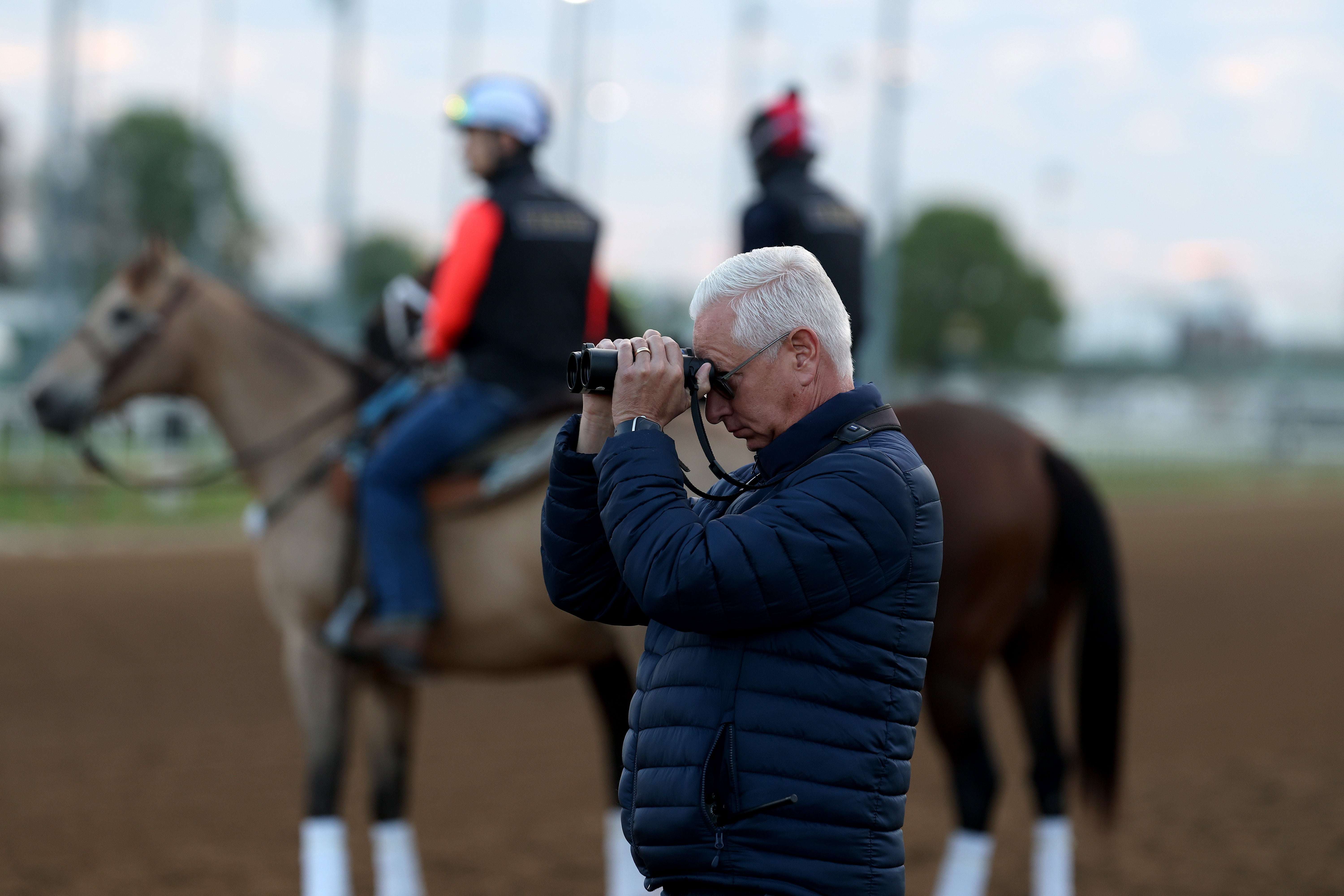 OUISVILLE, KENTUCKY - APRIL 28: Todd Pletcher the trainer of Grande watches his horse during the morning training in preparation for the 151st Kentucky Derby at Churchill Downs on April 28, 2025 in Louisville, Kentucky. (Photo by Andy Lyons/Getty Images)