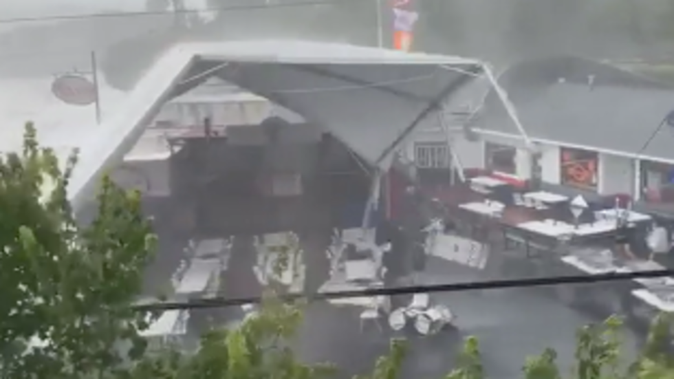 South Carolina Storm Sends Tent Flying with Two People Hanging On South Carolina Storm Sends Tent Flying with Two People Hanging On